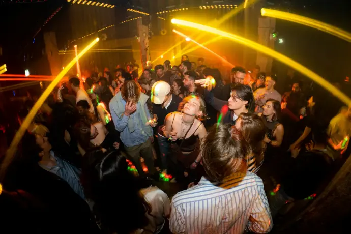 a group of people dancing at a party